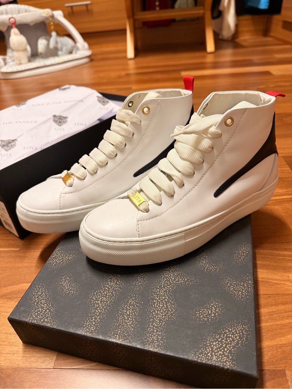 Lita by Ciara - White High-Top Sneakers with Black Accent and Gold Hardware